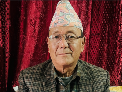 a man wears a dhaka topi